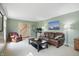 Inviting living room with stylish furniture, neutral carpet, and plenty of natural light at 1748 Sweet Gum Dr, Indianapolis, IN 46260