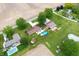 Aerial view of houses with in-ground pools surrounded by green space and farmland at 1891 W 300 N, Anderson, IN 46011