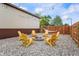 Relaxing backyard fire pit area with Adirondack chairs, string lights, and a hammock at 1891 W 300 N, Anderson, IN 46011