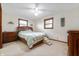 Bedroom featuring a large bed, stairs for pets, carpeted floor, and natural light at 1891 W 300 N, Anderson, IN 46011
