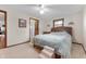 Bedroom featuring a large bed, stairs for pets, and carpeted floor at 1891 W 300 N, Anderson, IN 46011