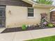 Charming exterior with well-maintained landscaping, decorative accents, and a paved walkway at 1891 W 300 N, Anderson, IN 46011