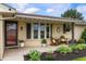 Inviting front porch and garden beds enhance the curb appeal of this brick home at 1891 W 300 N, Anderson, IN 46011