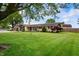 Well-maintained front yard and garden area enhance this charming single-Gathering home at 1891 W 300 N, Anderson, IN 46011