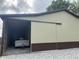 Large outbuilding with sliding door reveals ample storage space for a camper at 1891 W 300 N, Anderson, IN 46011
