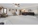 Spacious living room with a large leather couch, a fireplace, and views into the kitchen at 1891 W 300 N, Anderson, IN 46011