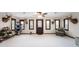 Bright living room features a front door, lots of windows, and unique decor and furnishings at 1891 W 300 N, Anderson, IN 46011