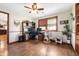 Bright home office with desk, chair, and windows overlooking yard at 1891 W 300 N, Anderson, IN 46011