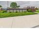 Above-ground pool with a wooden deck and ladder, set in a spacious, grassy yard at 1891 W 300 N, Anderson, IN 46011