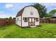 Exterior of a charming shed featuring a painted exterior, flower boxes, and a decorative star at 1891 W 300 N, Anderson, IN 46011