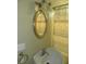 Bathroom view featuring a corner sink, oval mirror, and shower curtain at 203 W 3Rd St, Sheridan, IN 46069