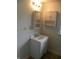 Bathroom featuring a white sink cabinet, mirrored cabinet and light fixture above the sink at 203 W 3Rd St, Sheridan, IN 46069