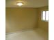 Neutral bedroom with a window and baseboard trim, perfect for relaxation at 203 W 3Rd St, Sheridan, IN 46069