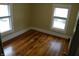 Bedroom with hardwood floors and two windows letting in ample natural light at 203 W 3Rd St, Sheridan, IN 46069
