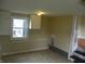Laundry room with a utility sink, window, and upper and lower cabinets at 203 W 3Rd St, Sheridan, IN 46069