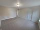 Comfortable bedroom with carpeted floor, natural light, and an open doorway at 2035 Theodore Dr, Indianapolis, IN 46214