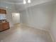 Bright dining room with tile flooring, overhead lighting, and a view of the kitchen at 2035 Theodore Dr, Indianapolis, IN 46214