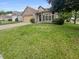 Attractive front exterior of a one-story brick home with a well manicured lawn at 2035 Theodore Dr, Indianapolis, IN 46214