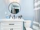 Contemporary bathroom featuring stylish fixtures, vanity with drawers, and sleek mirror at 2209 W 9Th St, Muncie, IN 47302