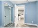 Bedroom with doorway leading to kitchen and mirrored closet at 2209 W 9Th St, Muncie, IN 47302