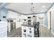 Well-equipped kitchen featuring stainless steel appliances, white cabinetry, and an island with seating at 2209 W 9Th St, Muncie, IN 47302