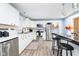 Beautiful kitchen with stainless steel appliances, white cabinets, and marble countertops at 2209 W 9Th St, Muncie, IN 47302