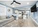 Open-concept living space with modern finishes, light blue walls, and adjoining kitchen at 2209 W 9Th St, Muncie, IN 47302