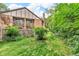 Manicured backyard with a lush lawn, mature landscaping and a fenced boundary at 2267 Rome Dr # A, Indianapolis, IN 46228