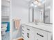 Bathroom featuring double vanity, large mirror and a linen closet at 2267 Rome Dr # A, Indianapolis, IN 46228