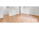 Bedroom featuring wood-look flooring, neutral paint, and abundant natural light at 2267 Rome Dr # A, Indianapolis, IN 46228