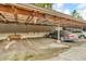 Covered carport parking with stacked wood storage for residents at 2267 Rome Dr # A, Indianapolis, IN 46228