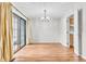 Dining area with sliding door and chandelier at 2267 Rome Dr # A, Indianapolis, IN 46228
