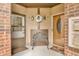 Charming entryway featuring a decorative bench, wreath, and two doors with brick accents at 2267 Rome Dr # A, Indianapolis, IN 46228