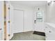 Bright foyer area featuring neutral paint, tile flooring, and a stylish front door at 2267 Rome Dr # A, Indianapolis, IN 46228