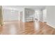 Open living room with wood floors and a decorative shelving unit at 2267 Rome Dr # A, Indianapolis, IN 46228
