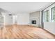 Living room features hardwood floors, brick fireplace and large windows at 2267 Rome Dr # A, Indianapolis, IN 46228