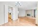 View of the dining and living rooms with hardwood floors at 2267 Rome Dr # A, Indianapolis, IN 46228