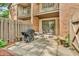 Private outdoor patio with table, chairs and grill, accessible from the home at 2267 Rome Dr # A, Indianapolis, IN 46228