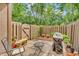 Charming private patio area with fenced in yard, table, chairs and grill at 2267 Rome Dr # A, Indianapolis, IN 46228