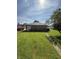 The backyard features a well-maintained lawn and a detached one-car garage with easy access at 2310 Noble St, Anderson, IN 46016
