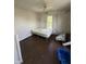 Bedroom featuring a bed, hardwood floors and a window at 2310 Noble St, Anderson, IN 46016