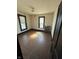 Empty bedroom featuring hardwood floors, peeling walls and a radiator at 2310 Noble St, Anderson, IN 46016