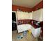 Kitchen featuring white cabinetry and red countertop at 2310 Noble St, Anderson, IN 46016