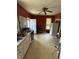 Kitchen with stove, refrigerator, a sink, and an entrance to the outside at 2310 Noble St, Anderson, IN 46016