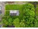 Aerial view of a house with a big yard surrounded by mature trees and marked with yellow property lines at 2622 Ethel Ave, Indianapolis, IN 46208