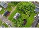 Aerial view of a house with a big yard surrounded by mature trees and marked with yellow property lines at 2622 Ethel Ave, Indianapolis, IN 46208