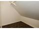 Small attic closet with simple white walls and patterned carpet at 2622 Ethel Ave, Indianapolis, IN 46208