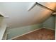 Attic crawl space area with open shelves and carpeted floor at 2622 Ethel Ave, Indianapolis, IN 46208