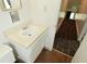 Bathroom features a sink, vanity, and doorway to hallway at 2622 Ethel Ave, Indianapolis, IN 46208