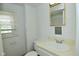 Bright bathroom with a window, mirror, and vanity at 2622 Ethel Ave, Indianapolis, IN 46208